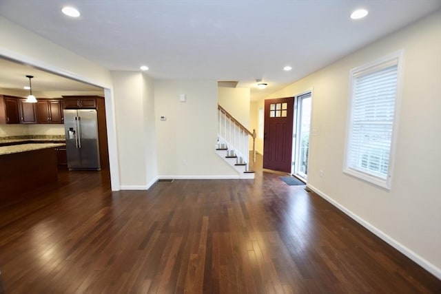 entrance foyer with dark hardwood / wood-style flooring