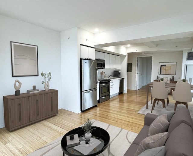 2 Earhart St Unit Ph6, Cambridge, MA 02141 - living area with light wood-style floors, baseboards, and recessed lighting