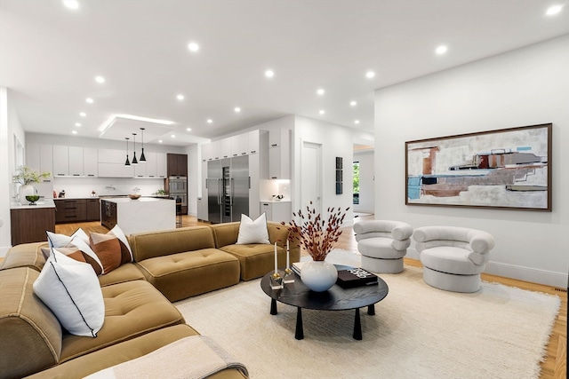 living room with light hardwood / wood-style flooring