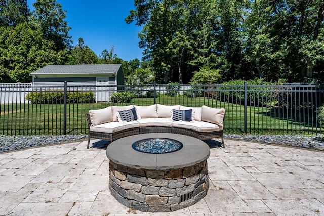 view of patio / terrace with an outdoor living space with a fire pit