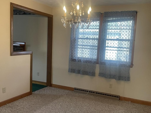 carpeted spare room with a chandelier and baseboard heating