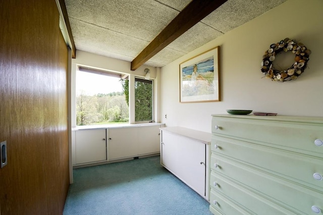 interior space featuring beamed ceiling