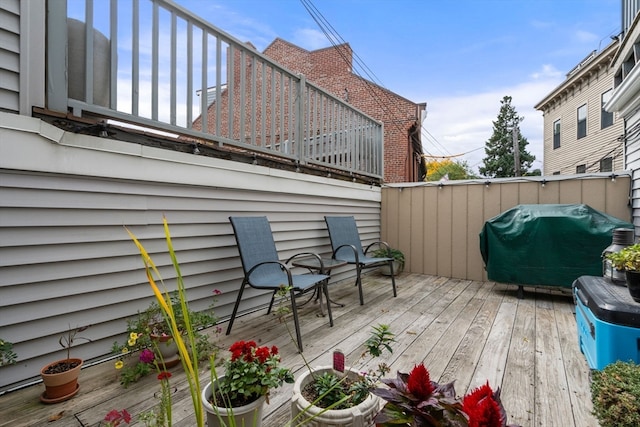 wooden deck with grilling area