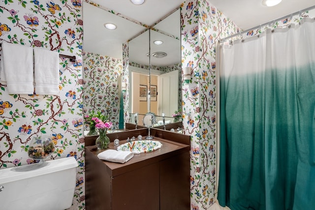 bathroom featuring vanity and toilet