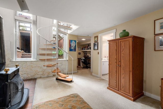 stairs with carpet floors and plenty of natural light