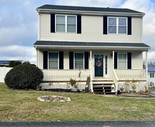 view of front facade with a front lawn and a porch