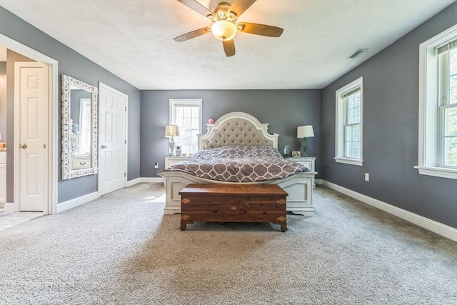 121 Adams Rd, East Brookfield, MA 01515 - carpeted bedroom with multiple windows and a ceiling fan