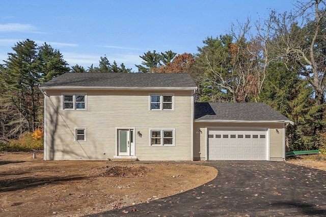 front facade with a garage