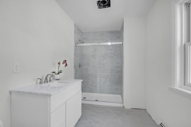 bathroom featuring vanity and a shower with shower door