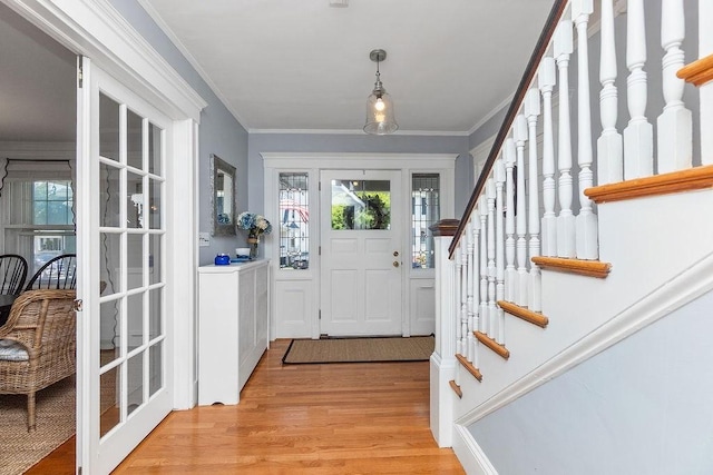 94 Circuit Rd, Winthrop, MA 02152 - entryway featuring light wood-style floors, stairway, and crown molding