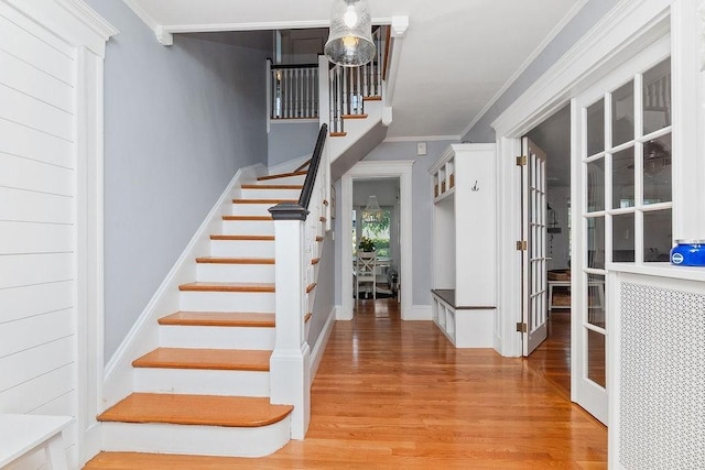 94 Circuit Rd, Winthrop, MA 02152 - entrance foyer with stairway, wood finished floors, and crown molding