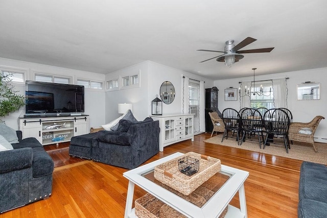 94 Circuit Rd, Winthrop, MA 02152 - living room featuring ceiling fan, a chandelier, wood finished floors, and baseboard heating