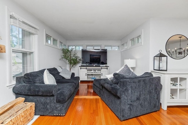 94 Circuit Rd, Winthrop, MA 02152 - living area with a chandelier, plenty of natural light, and wood finished floors