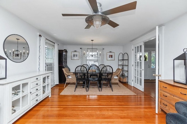 94 Circuit Rd, Winthrop, MA 02152 - dining area featuring a chandelier, light wood-style floors, and french doors