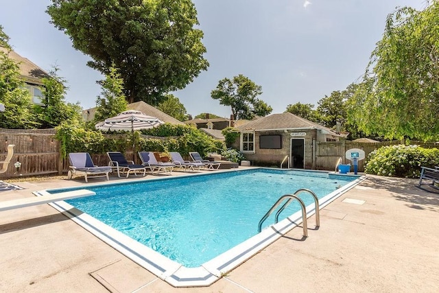 94 Circuit Rd, Winthrop, MA 02152 - view of swimming pool featuring a patio area and a diving board