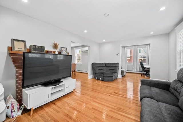 8 Nicholl St, Quincy, MA 02169 - living room featuring a wall unit AC, light wood-type flooring, a baseboard heating unit, healthy amount of natural light, and recessed lighting