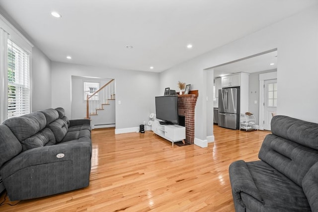 8 Nicholl St, Quincy, MA 02169 - living room with baseboard heating, stairs, light wood-style floors, and recessed lighting