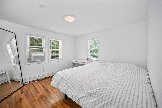 8 Nicholl St, Quincy, MA 02169 - bedroom featuring wood finished floors, baseboard heating, and cooling unit
