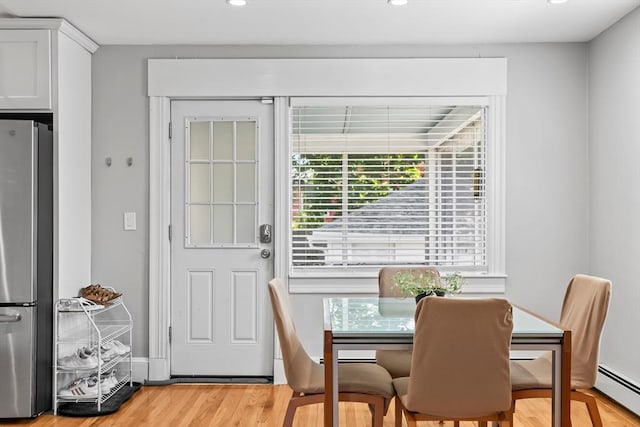 8 Nicholl St, Quincy, MA 02169 - dining room featuring a baseboard heating unit, light wood-style flooring, healthy amount of natural light, and recessed lighting