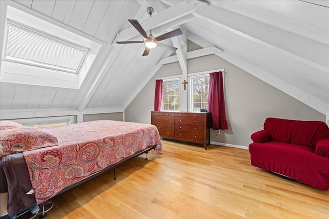 bedroom with vaulted ceiling with beams, wood finished floors, and a ceiling fan