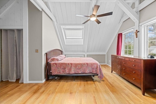 bedroom with light wood-style flooring, ceiling fan, vaulted ceiling, and baseboards
