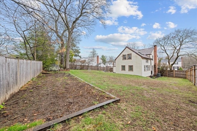view of yard featuring a fenced backyard and cooling unit