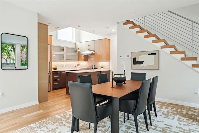 95 Kirkland St Unit 95, Cambridge, MA 02138 - dining area featuring light wood finished floors and stairs