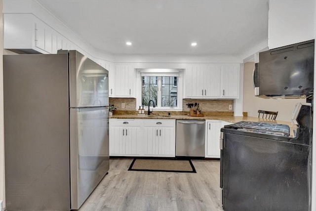 98 Haseltine St, Haverhill, MA 01835 - kitchen with stainless steel appliances, a sink, white cabinetry, light wood finished floors, and recessed lighting