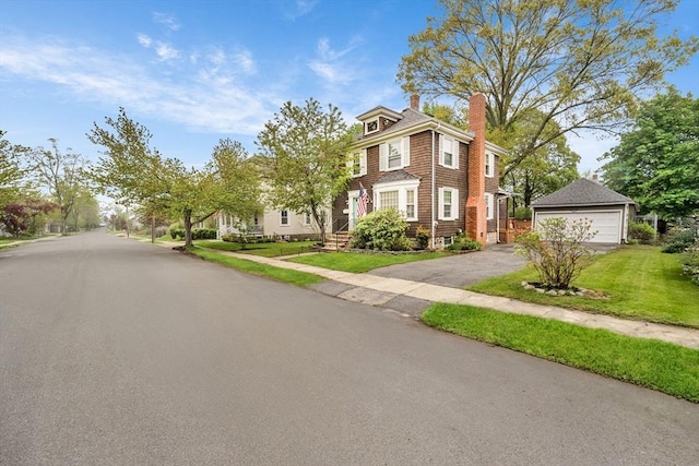 98 Haseltine St, Haverhill, MA 01835 - american foursquare style home featuring a chimney, a detached garage, an outdoor structure, and a front yard