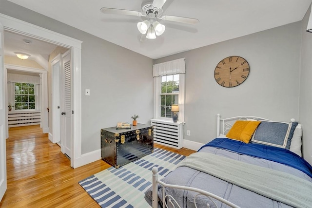98 Haseltine St, Haverhill, MA 01835 - bedroom with light wood-type flooring, baseboards, and a ceiling fan