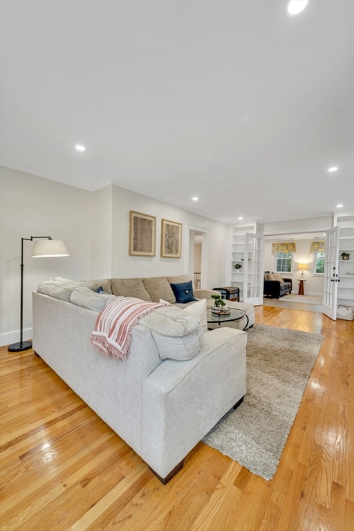 98 Haseltine St, Haverhill, MA 01835 - living room featuring light wood-style floors, recessed lighting, and baseboards