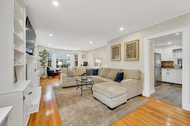 98 Haseltine St, Haverhill, MA 01835 - living room with light wood-type flooring, healthy amount of natural light, and recessed lighting