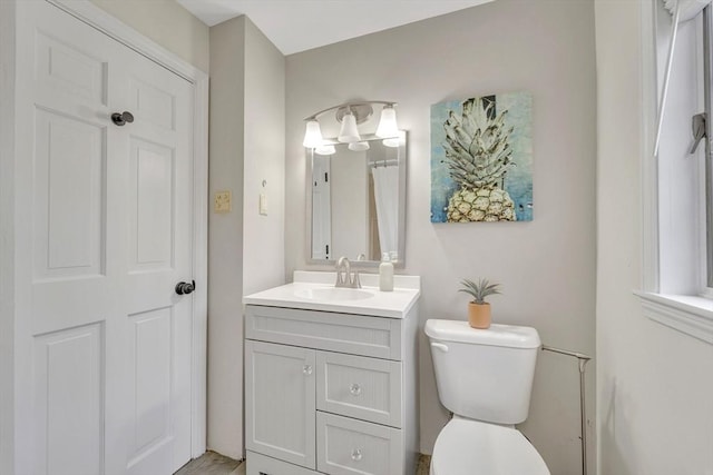 98 Haseltine St, Haverhill, MA 01835 - bathroom featuring vanity and toilet
