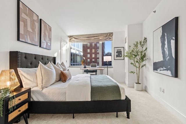 bedroom featuring light colored carpet