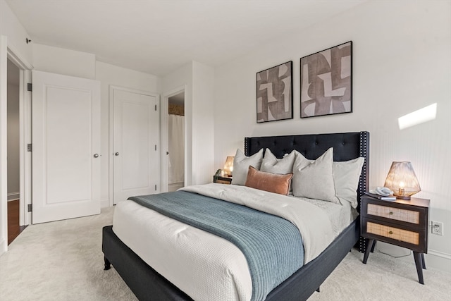 bedroom with light colored carpet