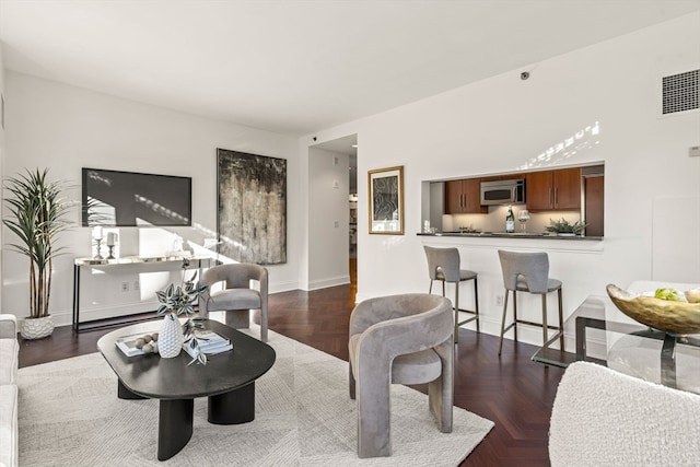 living room with dark parquet floors