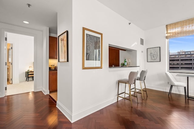 hallway with dark parquet floors