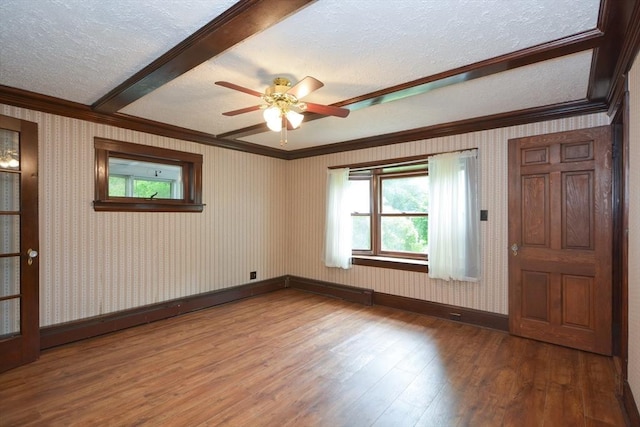 241 Fisher St, Walpole, MA 02081 - empty room featuring ornamental molding, a textured ceiling, wood finished floors, and ceiling fan