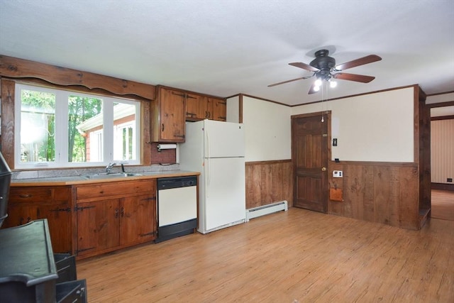 241 Fisher St, Walpole, MA 02081 - kitchen featuring a baseboard heating unit, white appliances, brown cabinets, light countertops, and wood walls