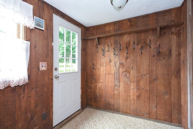 241 Fisher St, Walpole, MA 02081 - mudroom featuring wood walls and tile patterned floors