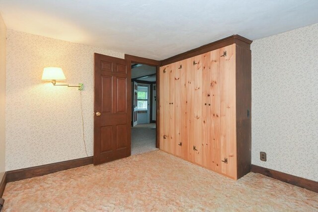 241 Fisher St, Walpole, MA 02081 - carpeted empty room featuring wallpapered walls and baseboards