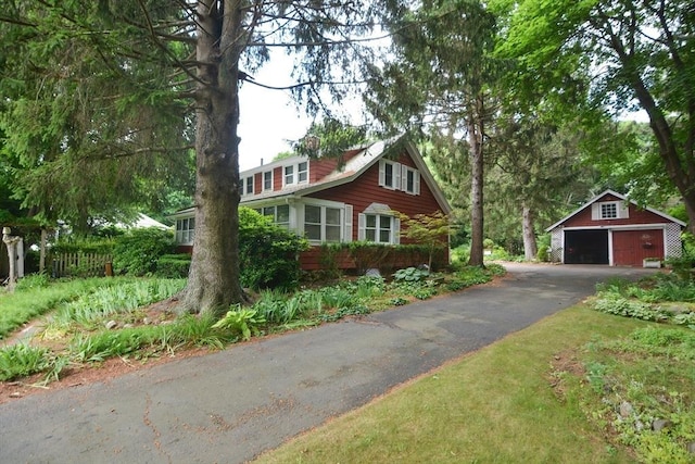 241 Fisher St, Walpole, MA 02081 - view of front of home with a detached garage and an outdoor structure
