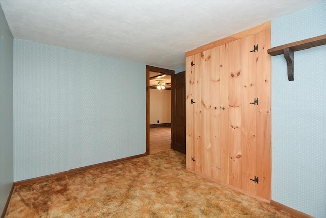 241 Fisher St, Walpole, MA 02081 - carpeted empty room with baseboards and a ceiling fan