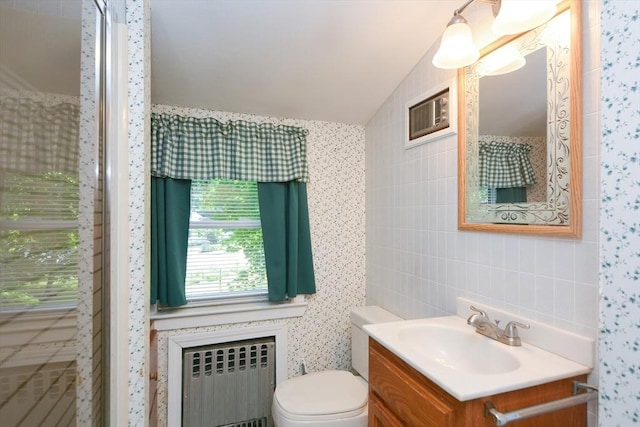 241 Fisher St, Walpole, MA 02081 - bathroom featuring radiator, vanity, and tile walls