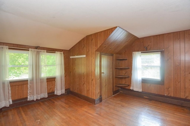 241 Fisher St, Walpole, MA 02081 - empty room with vaulted ceiling, wood finished floors, and wooden walls