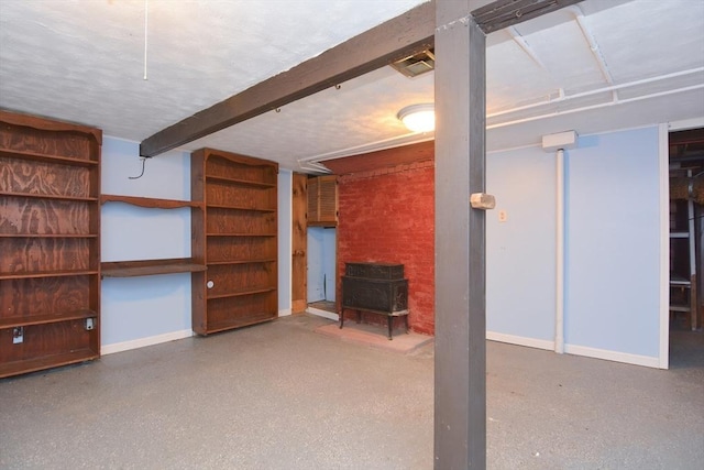 241 Fisher St, Walpole, MA 02081 - below grade area featuring a wood stove and baseboards