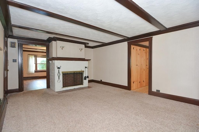 241 Fisher St, Walpole, MA 02081 - unfurnished living room with carpet floors, ornamental molding, a brick fireplace, beamed ceiling, and a textured ceiling