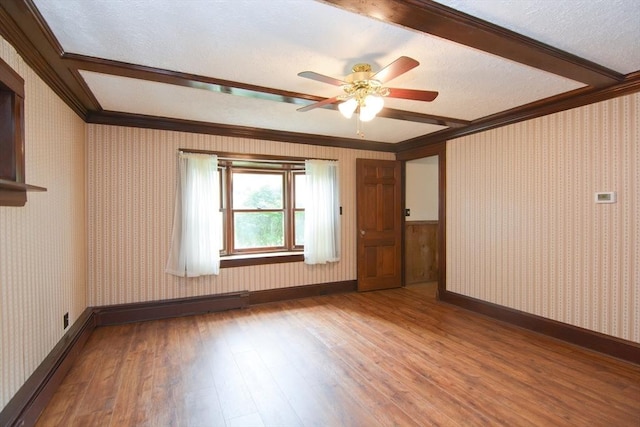 241 Fisher St, Walpole, MA 02081 - unfurnished room featuring wood finished floors, crown molding, a ceiling fan, wallpapered walls, and a textured ceiling