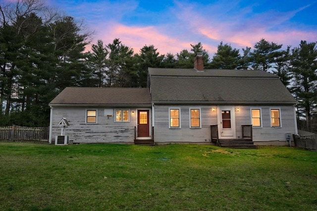 2045 Washington St, East Bridgewater, MA 02333 - colonial inspired home featuring entry steps, a chimney, fence, and a front lawn