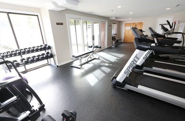 exercise room featuring recessed lighting and baseboards
